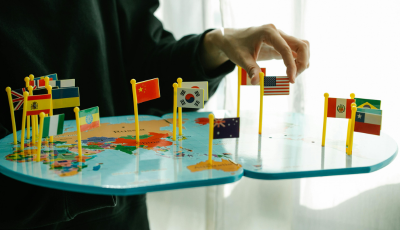 Person moving flags on map