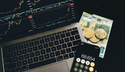 Laptop, calculator and cash