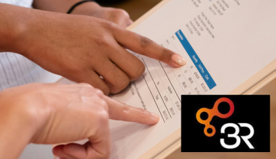 People pointing at stats on sheet of paper