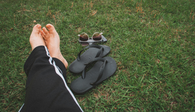 Legs of someone relaxing on grass